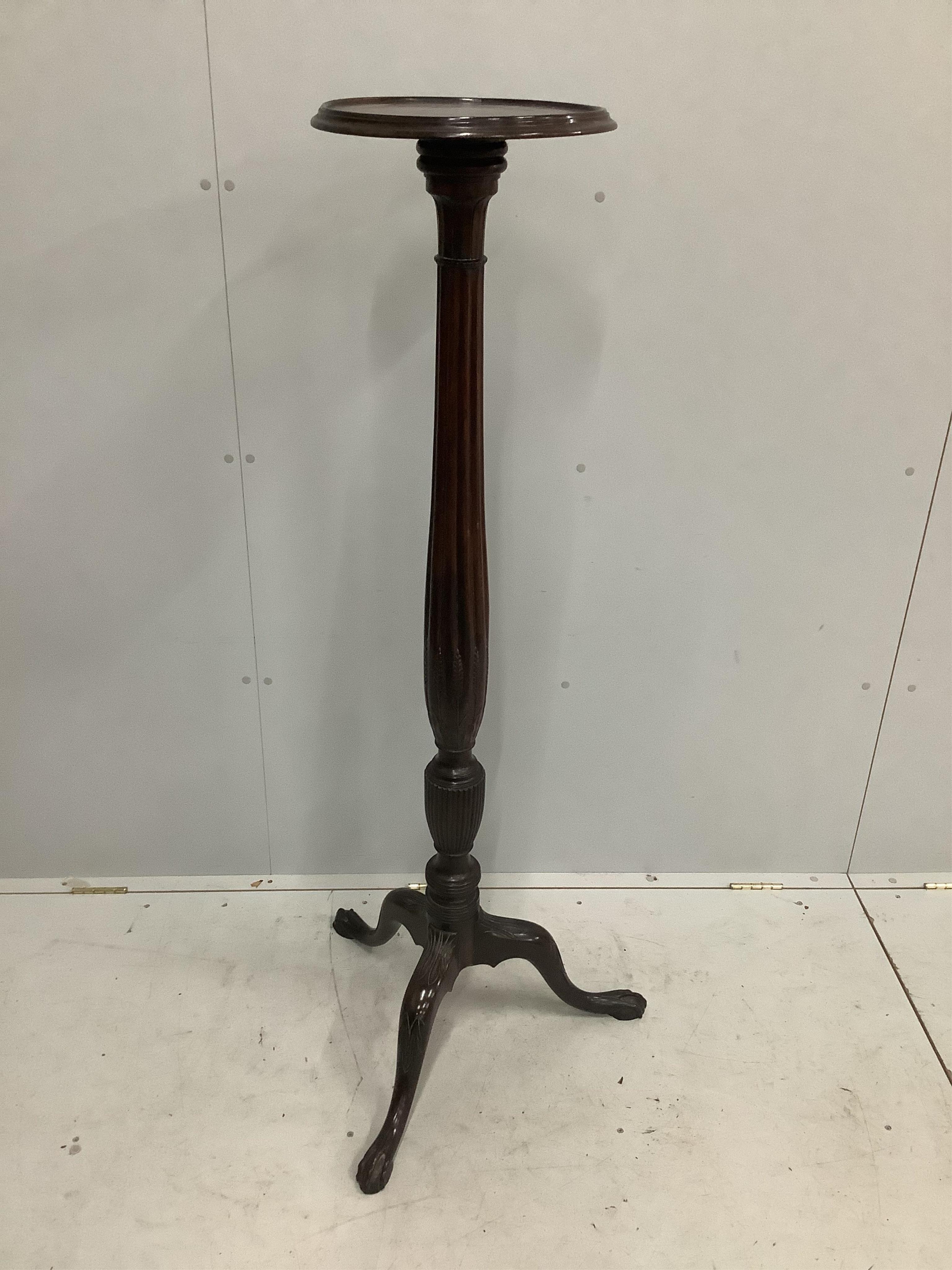 A George III style mahogany torchere, height 148cm. Condition - fair